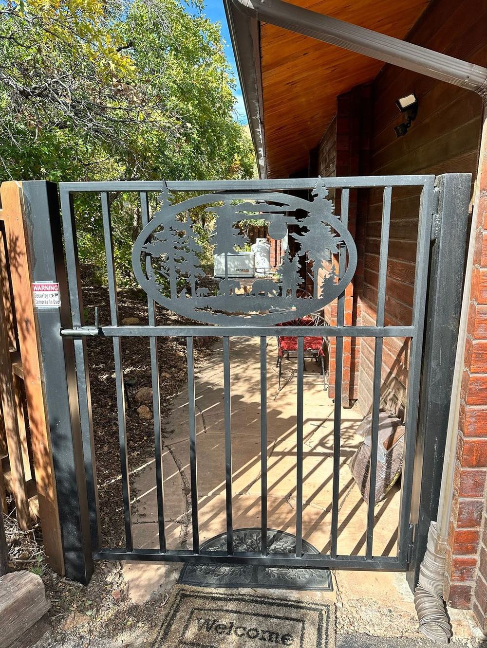 Custom ornamental iron gate installation — Omaha metro