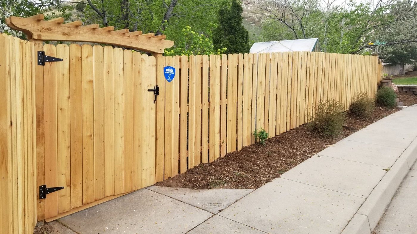 Cedar privacy fence with arched gate — Papillion NE area